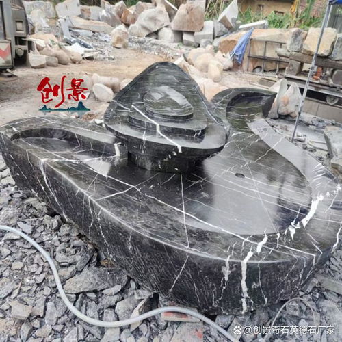 廣東異形黑山石加工廠家 黑山石水缽創(chuàng)意全面實景拍攝案例圖