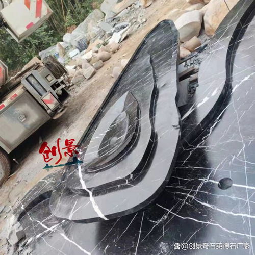廣東異形黑山石加工廠家 黑山石水缽創(chuàng)意全面實景拍攝案例圖
